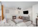 Cozy living room featuring a fireplace, a comfortable sectional sofa, and neutral decor at 6087 Diamond Pl, Harrisburg, NC 28075