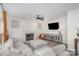 Cozy living room featuring a fireplace, a comfortable sectional sofa, and neutral decor at 6087 Diamond Pl, Harrisburg, NC 28075