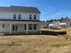 A spacious backyard featuring a well-manicured lawn and a view of the rear exterior of the home at 619 Amberjack Pl, York, SC 29745