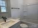 Well-lit bathroom featuring a modern vanity and a tub with shower at 619 Amberjack Pl, York, SC 29745