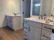 Stylish bathroom with double sink vanities featuring quartz countertops and dark hardware at 619 Amberjack Pl, York, SC 29745