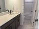 Bathroom featuring tile floors, quartz counters, and bath with tile surround at 619 Amberjack Pl, York, SC 29745