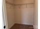 Walk-in closet with carpet flooring and wire shelves for optimal storage at 619 Amberjack Pl, York, SC 29745