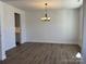 An empty dining room featuring modern lighting fixture and sleek flooring at 619 Amberjack Pl, York, SC 29745