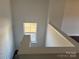 Hallway with white walls, white trim, and wood-look floors at 619 Amberjack Pl, York, SC 29745