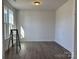 Bright, newly constructed room with wood flooring and a window providing natural light at 619 Amberjack Pl, York, SC 29745