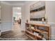 Elegant hallway with crown molding, wood floors, and decorative console table at 6275 Tea Olive Dr # 176, Harrisburg, NC 28075