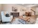 Open-concept living room showcasing stylish decor, wood floors, and abundant natural light near the dining area at 6275 Tea Olive Dr # 176, Harrisburg, NC 28075