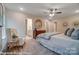 Bright main bedroom featuring a large bed, soft lighting, neutral decor, and ensuite bathroom access at 6275 Tea Olive Dr # 176, Harrisburg, NC 28075