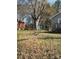 Large backyard with trees at 701 Betty St, Gastonia, NC 28054