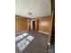 Comfortable bedroom with carpeted floors and wood paneling, illuminated by natural light at 701 Betty St, Gastonia, NC 28054