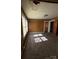 Cozy bedroom showcasing wood paneling, carpeted floors, and natural light from the windows at 701 Betty St, Gastonia, NC 28054