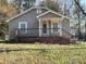 Charming single-story home featuring a covered front porch and simple landscaping at 701 Betty St, Gastonia, NC 28054