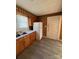 Bright kitchen includes ample counter space, a classic white refrigerator and a door leading outside at 701 Betty St, Gastonia, NC 28054