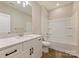 Bright bathroom featuring vanity, modern fixtures, granite countertops, shower and tub at 8029 Joy Crossing Ln, Charlotte, NC 28214