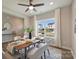 Dining room with a table set for six, a large window, and view of neighborhood at 8029 Joy Crossing Ln, Charlotte, NC 28214
