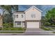 Charming two-story home with a two-car garage, tidy landscaping, and a modern farmhouse style at 8029 Joy Crossing Ln, Charlotte, NC 28214