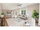Open-concept living area with lots of natural light, seamlessly connected to the kitchen and dining area at 8029 Joy Crossing Ln, Charlotte, NC 28214