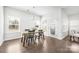 Bright dining room with hardwood floors, natural light, and modern table set at 815 Foxmeade Ct, Salisbury, NC 28144