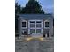 Charming outdoor shed featuring a wood deck, classic doors, and elegant string lights for cozy outdoor space at 815 Foxmeade Ct, Salisbury, NC 28144