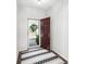 Bright foyer featuring a patterned rug and a charming entryway, showcasing the welcoming ambiance of the home at 815 Foxmeade Ct, Salisbury, NC 28144