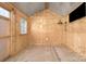 The interior of the unfinished shed features a corrugated metal roof and wooden walls at 815 Foxmeade Ct, Salisbury, NC 28144