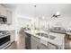 Kitchen with stainless steel appliances and granite countertops, seamlessly connecting to the dining and living areas at 815 Foxmeade Ct, Salisbury, NC 28144