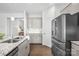 Modern kitchen featuring granite countertops, stainless steel appliances, and hardwood floors at 815 Foxmeade Ct, Salisbury, NC 28144