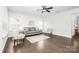 Bright living room with hardwood floors, neutral furniture, and a ceiling fan at 815 Foxmeade Ct, Salisbury, NC 28144