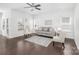 Open living room featuring hardwood floors, neutral furniture, and natural light at 815 Foxmeade Ct, Salisbury, NC 28144