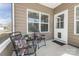 Cozy front porch with chairs, pillows, and decorative plants to enjoy the outdoors at 815 Foxmeade Ct, Salisbury, NC 28144