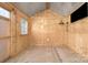 Interior of shed with plywood walls, metal roof, window and television installed at 815 Foxmeade Ct, Salisbury, NC 28144