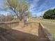 Outdoor wooden deck overlooking green backyard and shed with beautiful blue sky and landscape at 82 22Nd Nw Ave, Hickory, NC 28601