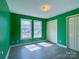 Bedroom showcasing laminate flooring, two closets, and abundant natural light at 82 22Nd Nw Ave, Hickory, NC 28601