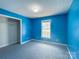 This spacious bedroom features carpeted floors, a closet, and a window that provides natural light at 82 22Nd Nw Ave, Hickory, NC 28601