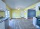 Eat in kitchen area boasting white cabinets, natural light, and stainless steel appliances at 82 22Nd Nw Ave, Hickory, NC 28601