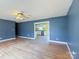 Living room looking into a kitchen space with white cabinets and stainless steel appliances at 82 22Nd Nw Ave, Hickory, NC 28601