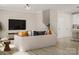 Open concept living room flowing into a kitchen, featuring modern furniture and ample natural light at 8947 Nettleton Ave, Charlotte, NC 28215