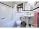 Classic bathroom featuring black and white tile, a pedestal sink, and a shower/tub combination at 1121 Myrtle Ave # 24, Charlotte, NC 28203