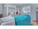 Cozy bedroom area featuring a built-in bed, sofa, and large window offering natural light and city views at 1121 Myrtle Ave # 24, Charlotte, NC 28203