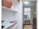 Neatly organized closet space with shelving and a view into an adjacent room with natural light at 1121 Myrtle Ave # 24, Charlotte, NC 28203