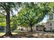 Exterior view of property showcasing beautiful trees and landscaping in a serene setting at 1121 Myrtle Ave # 24, Charlotte, NC 28203