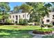 Classic architecture with lush green lawn, mature trees, and nicely kept landscaping at 1121 Myrtle Ave # 24, Charlotte, NC 28203