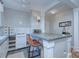 Functional kitchen features a tile breakfast bar with seating and ample countertop space at 1121 Myrtle Ave # 24, Charlotte, NC 28203