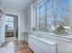 Sunlit area with a large window showcasing neighborhood views, complemented by classic architectural details at 1121 Myrtle Ave # 24, Charlotte, NC 28203