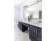 Bathroom featuring marble countertops, double sinks, and wood cabinets at 11215 Idlewild Rd, Matthews, NC 28105