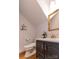 Elegant bathroom featuring a stylish vanity with gold fixtures, a vessel sink, and a luxurious toilet at 11215 Idlewild Rd, Matthews, NC 28105