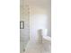 Bathroom featuring glass shower and white toilet at 11215 Idlewild Rd, Matthews, NC 28105