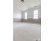 Large, carpeted bedroom featuring a two-toned wall design and double windows that provide plenty of natural light at 11215 Idlewild Rd, Matthews, NC 28105