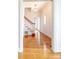 Hallway with hardwood floors and decorative staircase at 11215 Idlewild Rd, Matthews, NC 28105